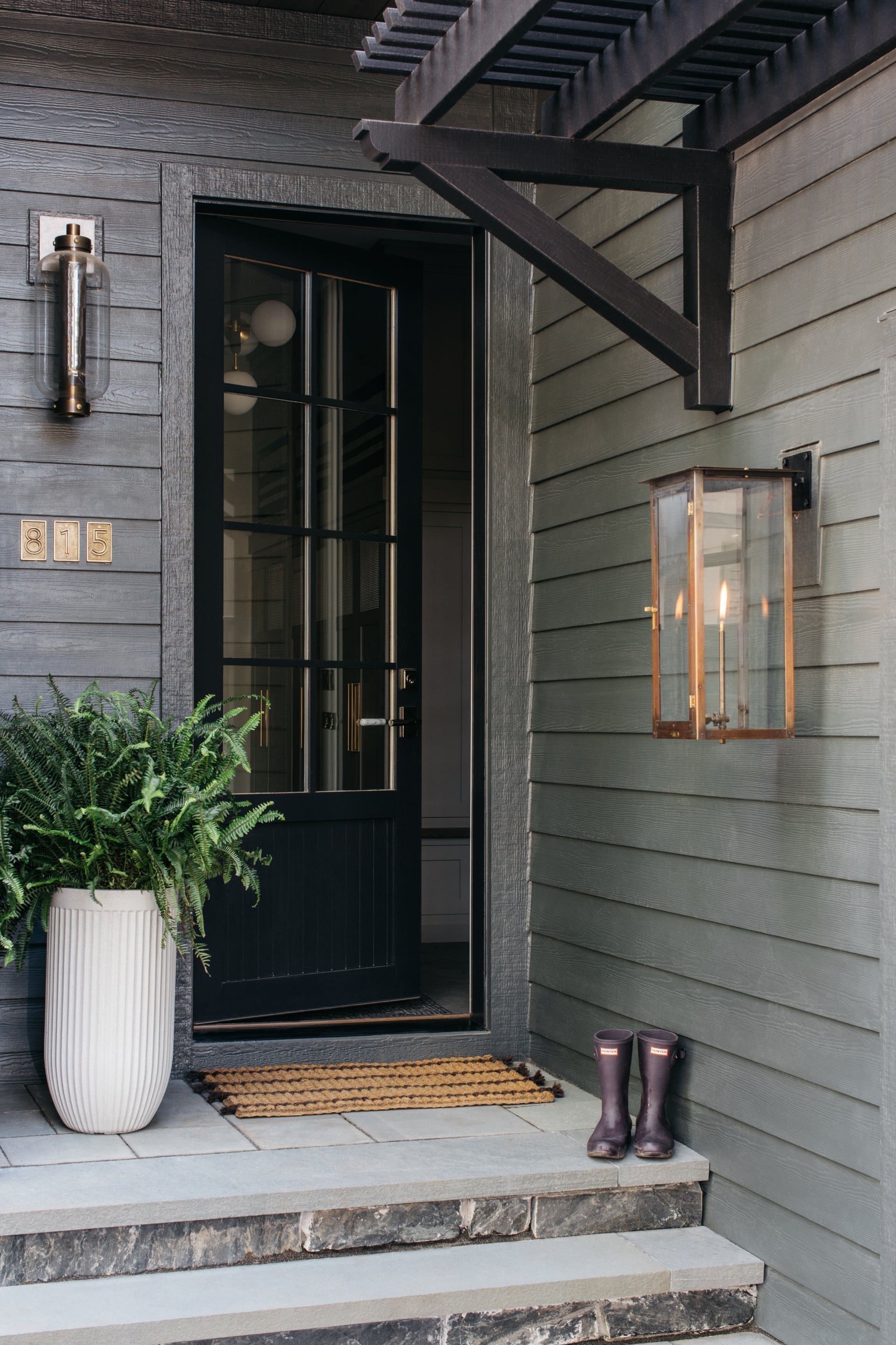 Atwater Medium Wall Sconce 23.25" by Troy Lighting in Patina Brass with Clear Glass Shade, UL Wet Rated