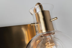 Mitzi Riley 2-Light Dimmable Vanity Light with Clear Glass Shades in Aged Brass or Polished Nickel