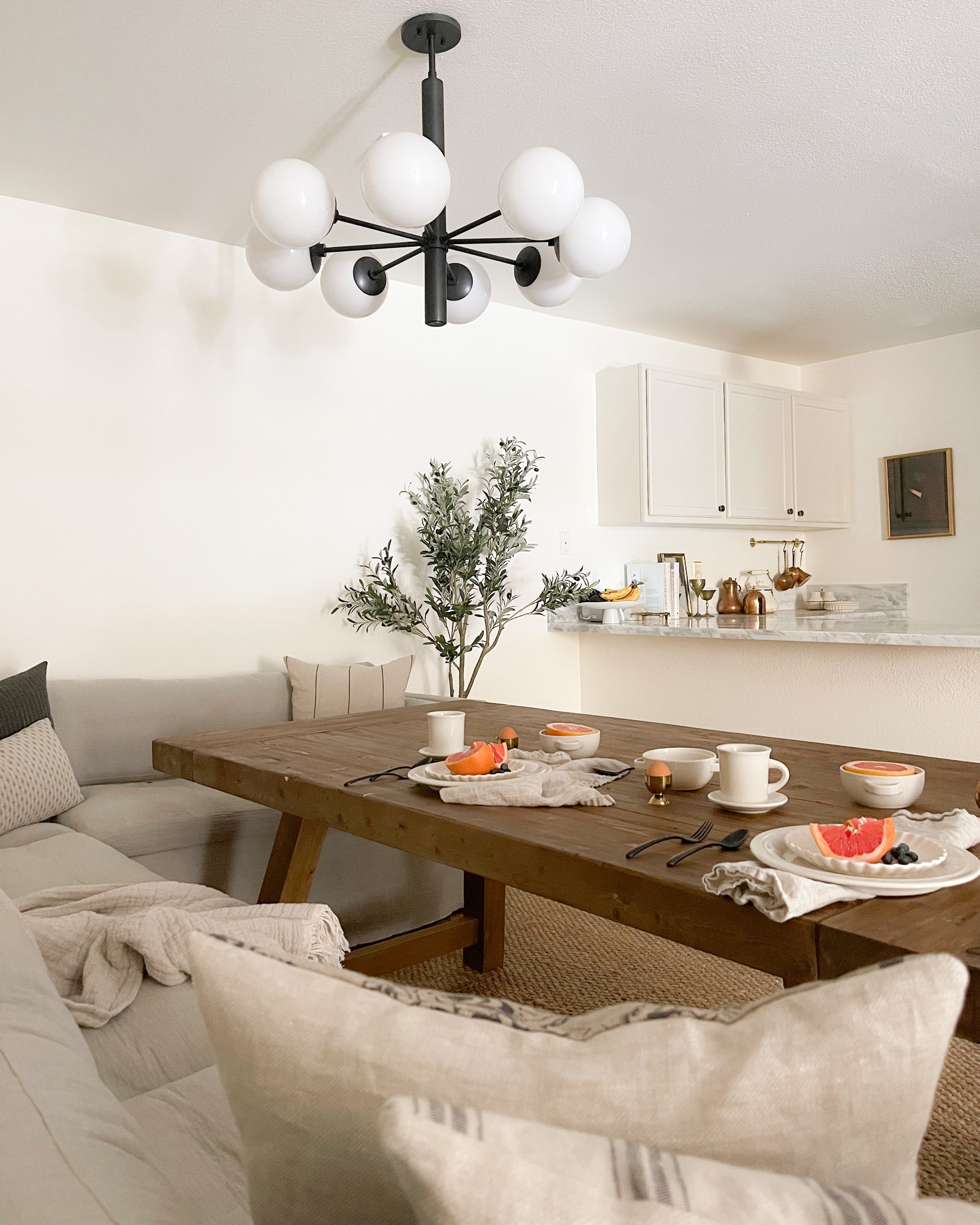 Mitzi Stella 8-Light Chandelier with Opal Glass Shades in Aged Brass and Old Bronze Finish