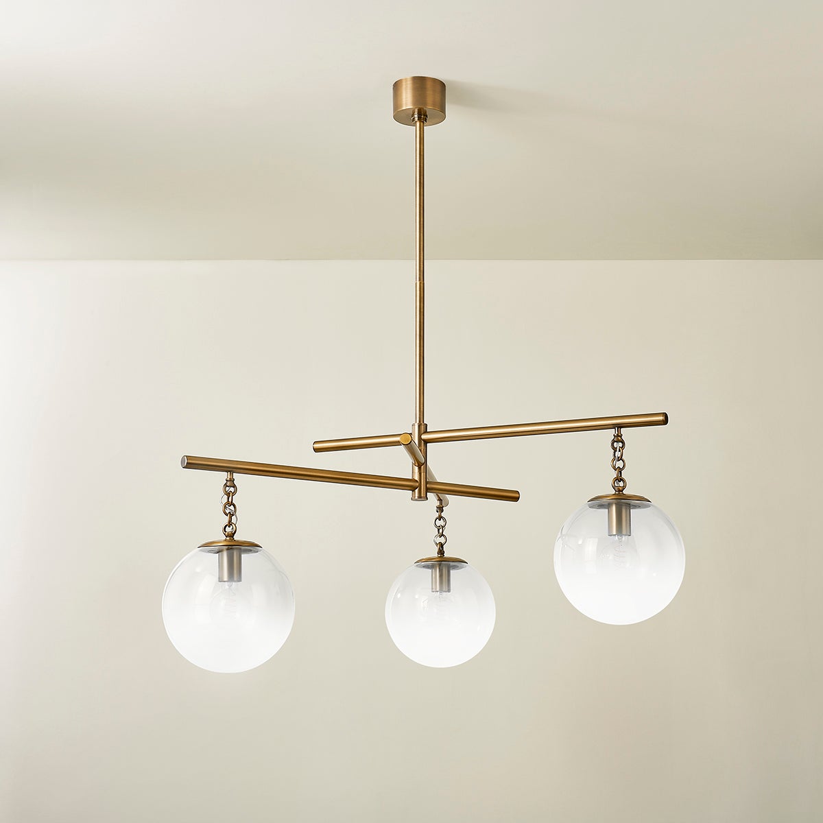Wade Chandelier by Troy Lighting with 3 Oversized Sfumato Glass Orbs and Patina Brass Finish, 20.75"H x 44.25"W