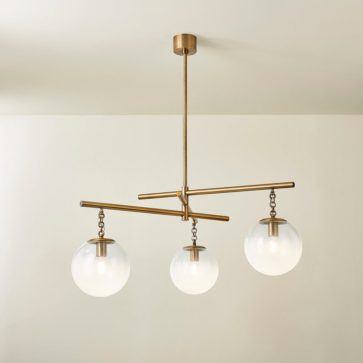 Wade Chandelier by Troy Lighting with 3 Oversized Sfumato Glass Orbs and Patina Brass Finish, 20.75"H x 44.25"W