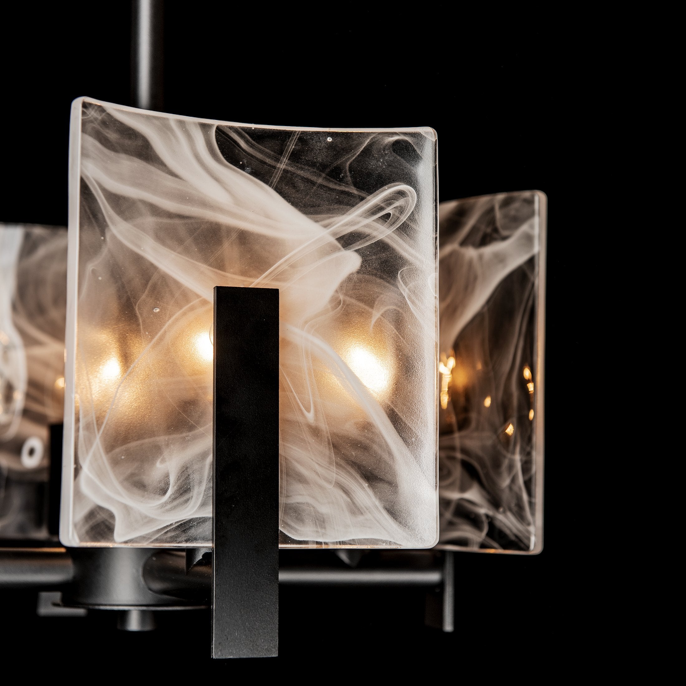 Curated luxury lighting collection featuring modern ceiling lights, chandeliers, and wall sconces