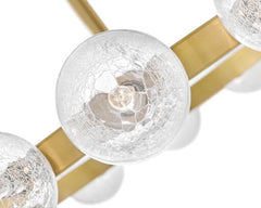 Coco Medium 12-Light Chandelier by Fredrick Ramond in Lacquered Brass with Crackle Glass Shades